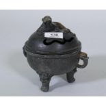 A bronze censer with kylin knop on a bowl with elephant mask handles and dragon supports, 17cm high