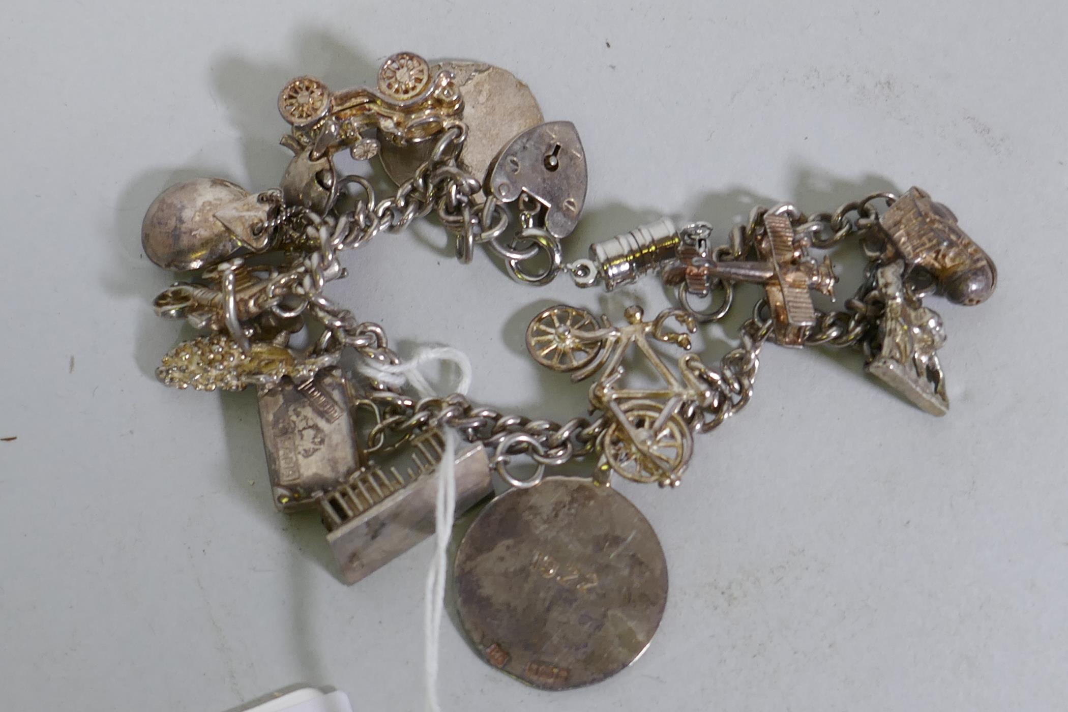 A silver charm bracelet, 48g