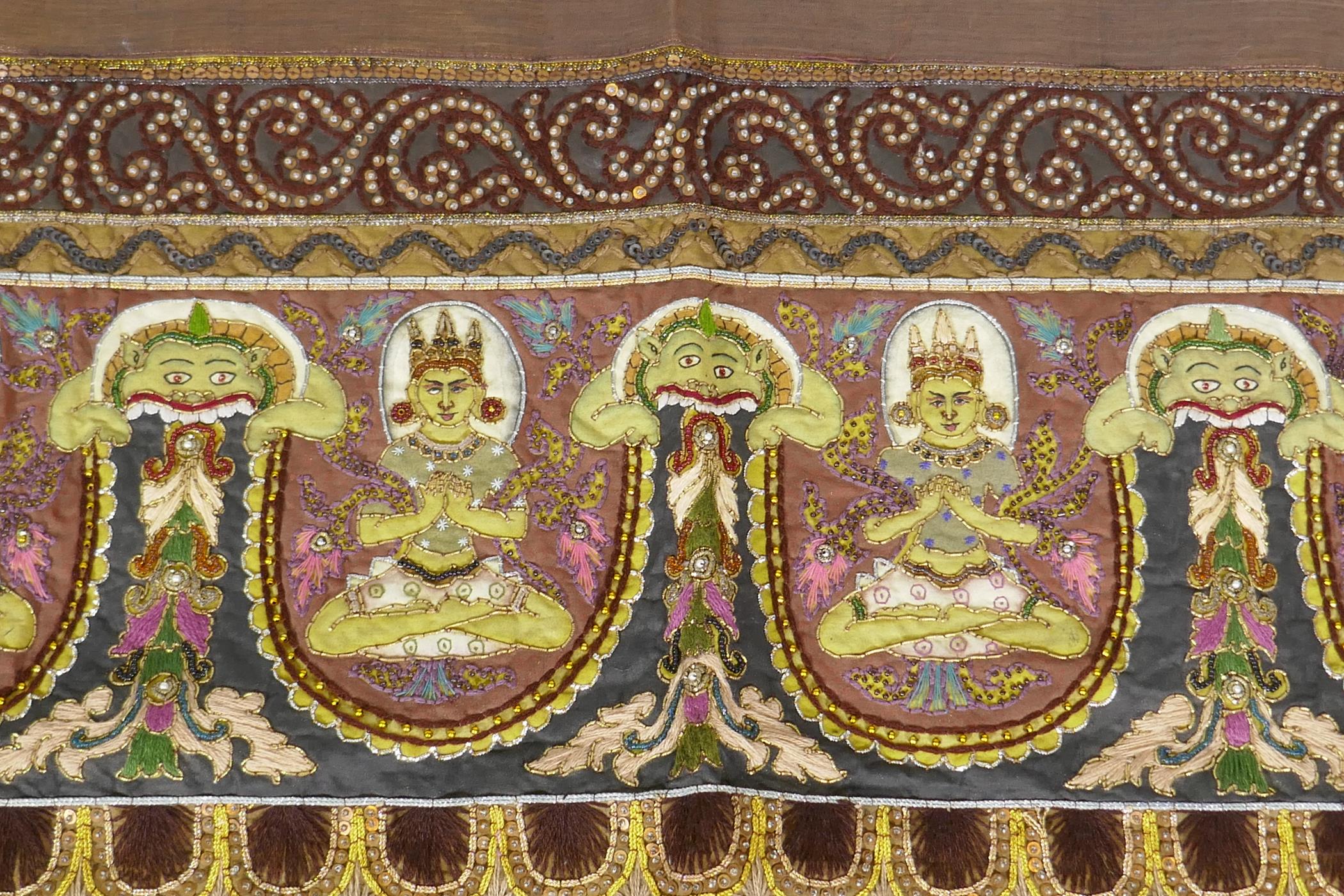 An antique Tibetan embroidered and beaded silk textile hanging, decorated with depictions of Buddha, - Image 5 of 8