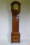 A C19th Irish mahogany eight day long case clock with arched hood and circular glass, the case