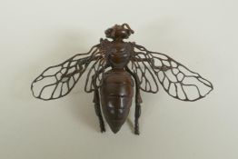 A Japanese style bronze okimono wasp, 10cm wide