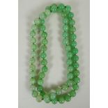 A light green jade bead necklace, 85cm