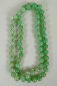 A light green jade bead necklace, 85cm