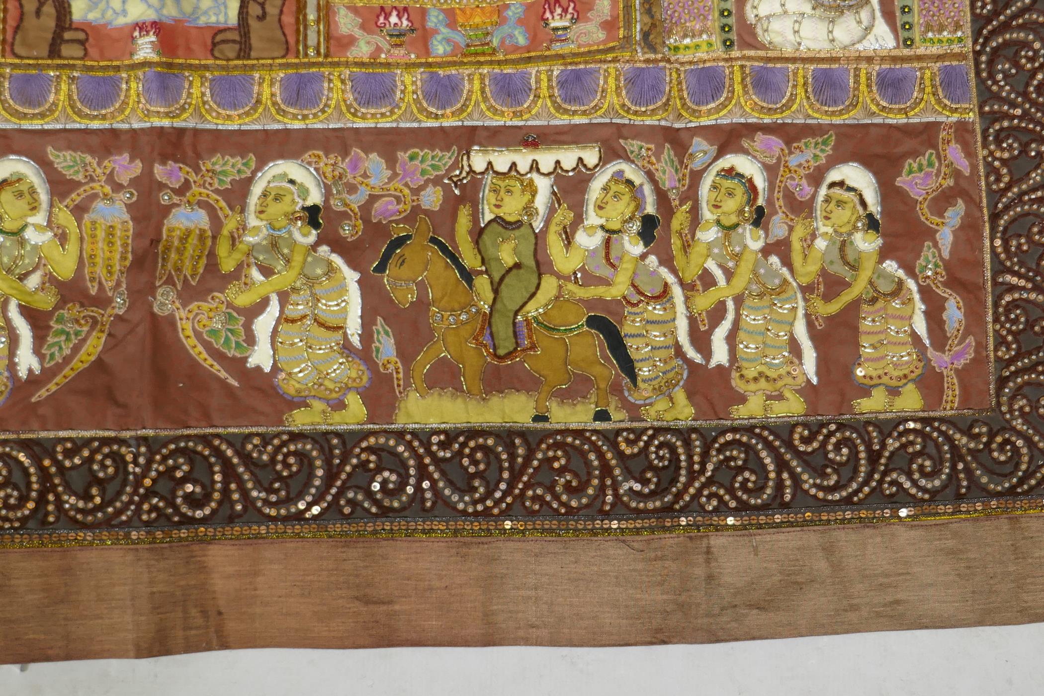 An antique Tibetan embroidered and beaded silk textile hanging, decorated with depictions of Buddha, - Image 7 of 8