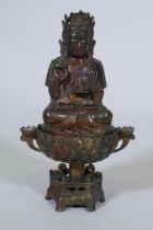 A bronze censer, the cover with seated Buddha, on a lotus bowl, 23cm high