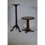 A Victorian mahogany torchere/jardiniere stand, raised on a fluted column with carved cabriole