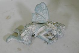 A cast iron garden figure of a sleeping fairy, 42cm long