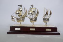A silver plated sailing trophy, the three ships of Columbus, on a wood base, 43 x 15 x 26cm