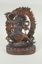 A Tibetan bronze figure of Vajrapani with remnants of gilt patina, 24cm high