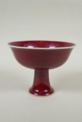 A Chinese flambe glazed porcelain stem bowl, Xuande character mark to base, 12cm high, 16cm diameter