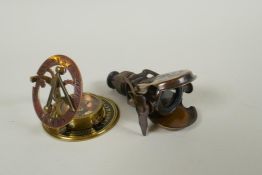 A reproduction 'R&J Beck Ltd' brass marine spy glass and a reproduction 'L. Casella & Co' sundial