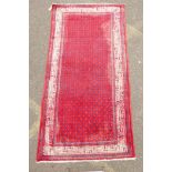 A Persian red ground wool Sarouk Mir rug, 208 x 108cm