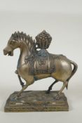 A Tibetan filled metal figure of a horse, 17cm high