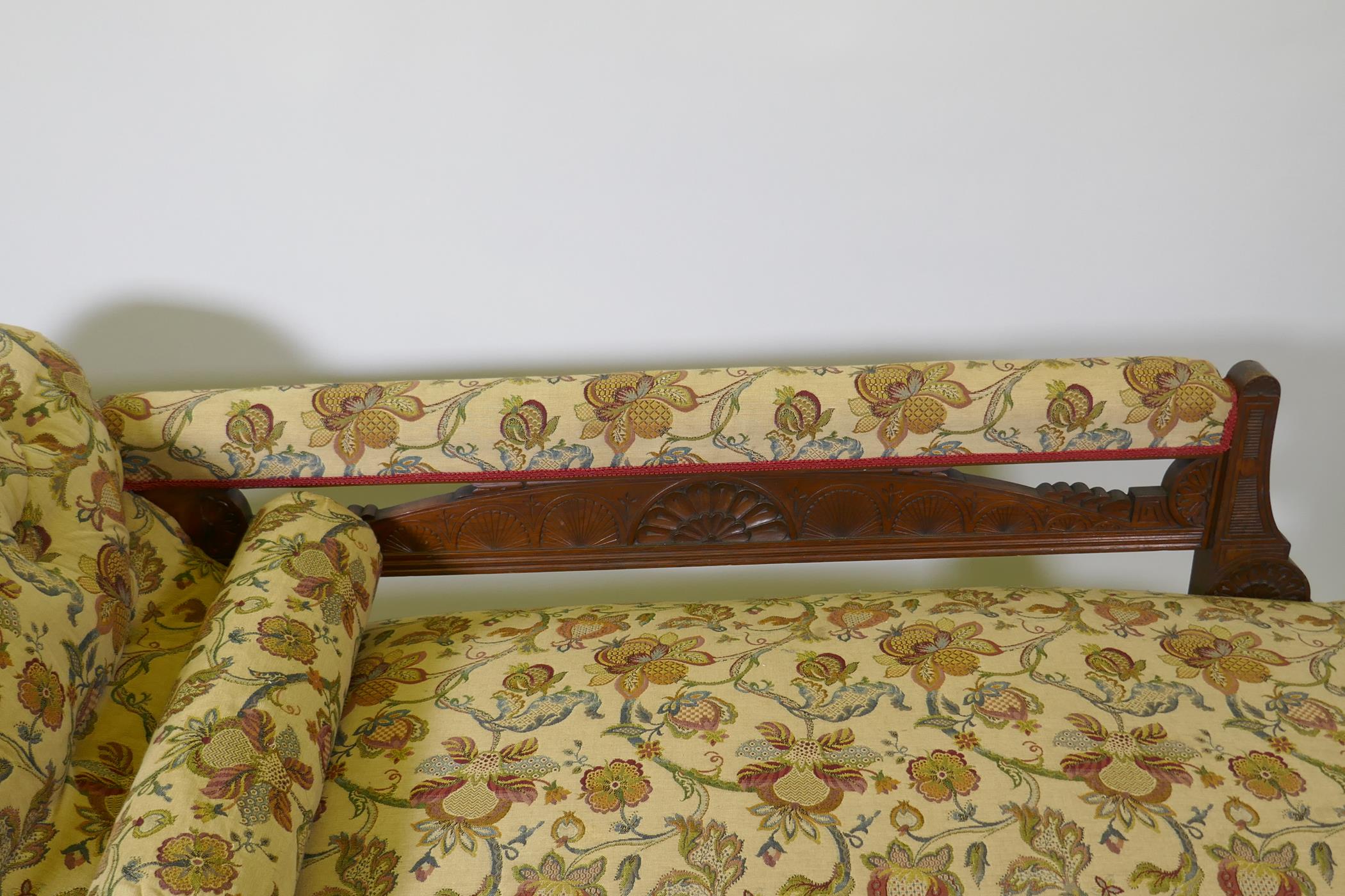 A Victorian walnut chaise longue with carved Grecian style decoration and good upholstery, 180cm - Image 4 of 4