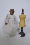 Antique wooden headed doll and a doll's tailor's dummy