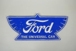 A 'Ford - The Universal Car' painted cast iron wall plaque, 38cm wide