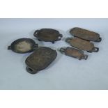 A collection of six South African Zulu wood meat platters, largest 44cm long