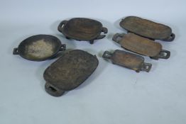 A collection of six South African Zulu wood meat platters, largest 44cm long