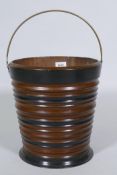 A C19th Dutch ebonised fruitwood peat bucket, 30cm high