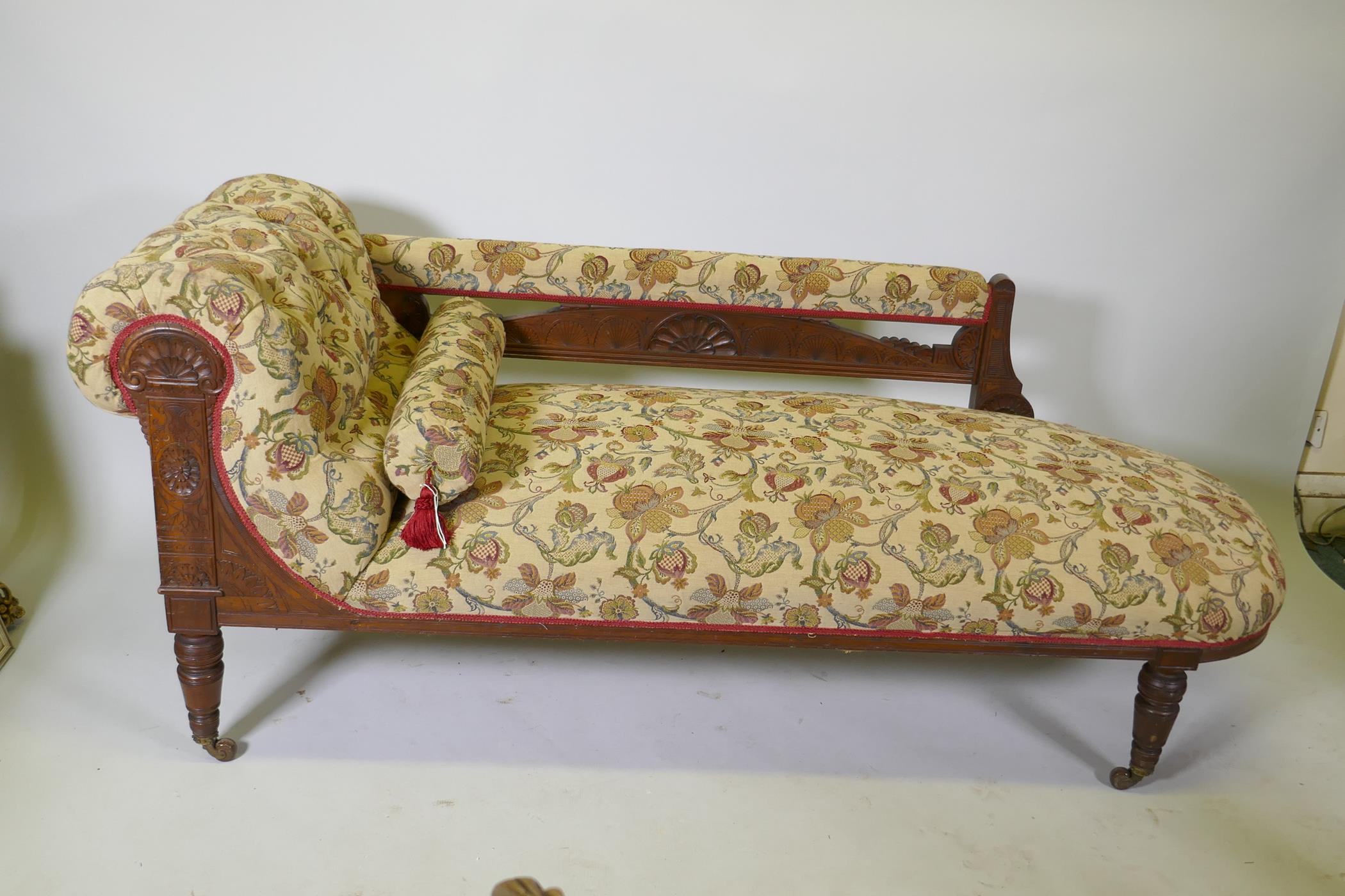 A Victorian walnut chaise longue with carved Grecian style decoration and good upholstery, 180cm - Image 2 of 4