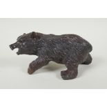 A filled bronze figure of a bear, 21cm long