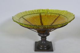 A studio amber glass bowl, raised n a bronzed metal stand, 38cm diameter, 24cm high