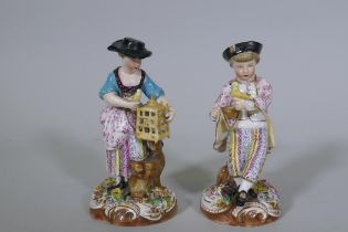 A pair of Continental hard paste porcelain figures, boy with a bird and a birdseller, factory mark