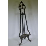 A C19th French carved and painted wood artist's easel, decorated with swags and flowers, AF