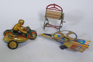 A vintage Japanese tin-plate 'Spectro Rocket', 25cm long, and a tin plate model of a motorcycle