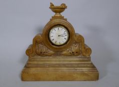 A C19th French alabaster mantel clock with enamelled dial and Brevete spring driven movement