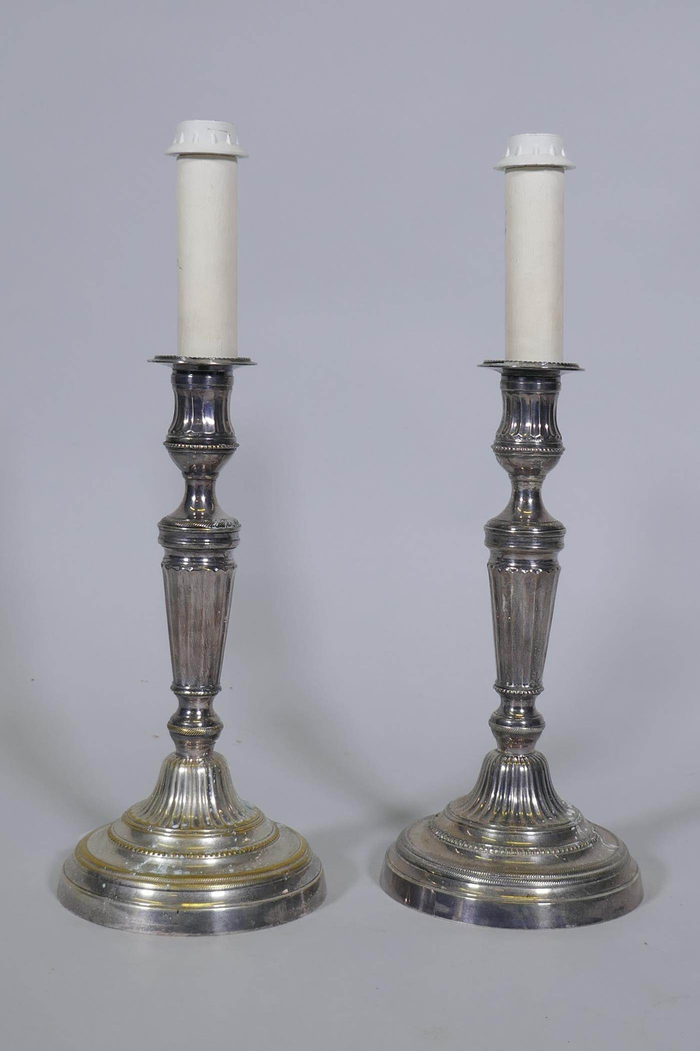 A pair of silver plate candlestick table lamps, 40cm high