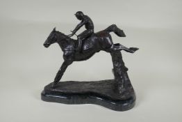 A bronze figure of a horse and jockey, 32cm high
