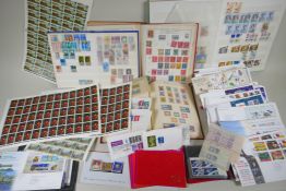 A large quantity of C19th, C20th and world postage stamps in albums, loose and attached to postcards
