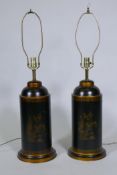 A pair of toleware table lamps with parcel gilt decoration on a black ground, 82cm high