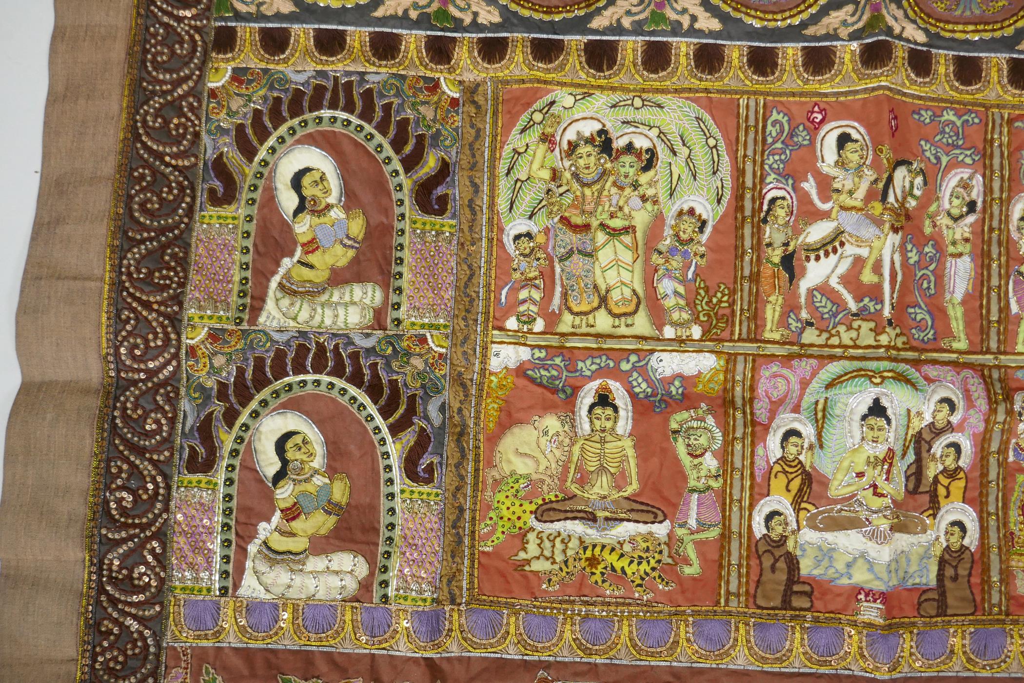 An antique Tibetan embroidered and beaded silk textile hanging, decorated with depictions of Buddha, - Image 2 of 8