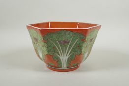 A Chinese coral red ground porcelain bowl of hexagonal form, with polychrome enamel decoration of