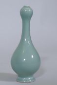 A Chinese garlic head vase with celadon glaze, seal mark to base, 18cm high