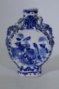A C19th Chinese blue and white pilgrim flask, decorated with exotic birds, 15cm high