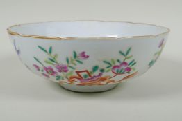 A late C19th Chinese famille rose porcelain bowl with lobed rim, decorated with flowers and