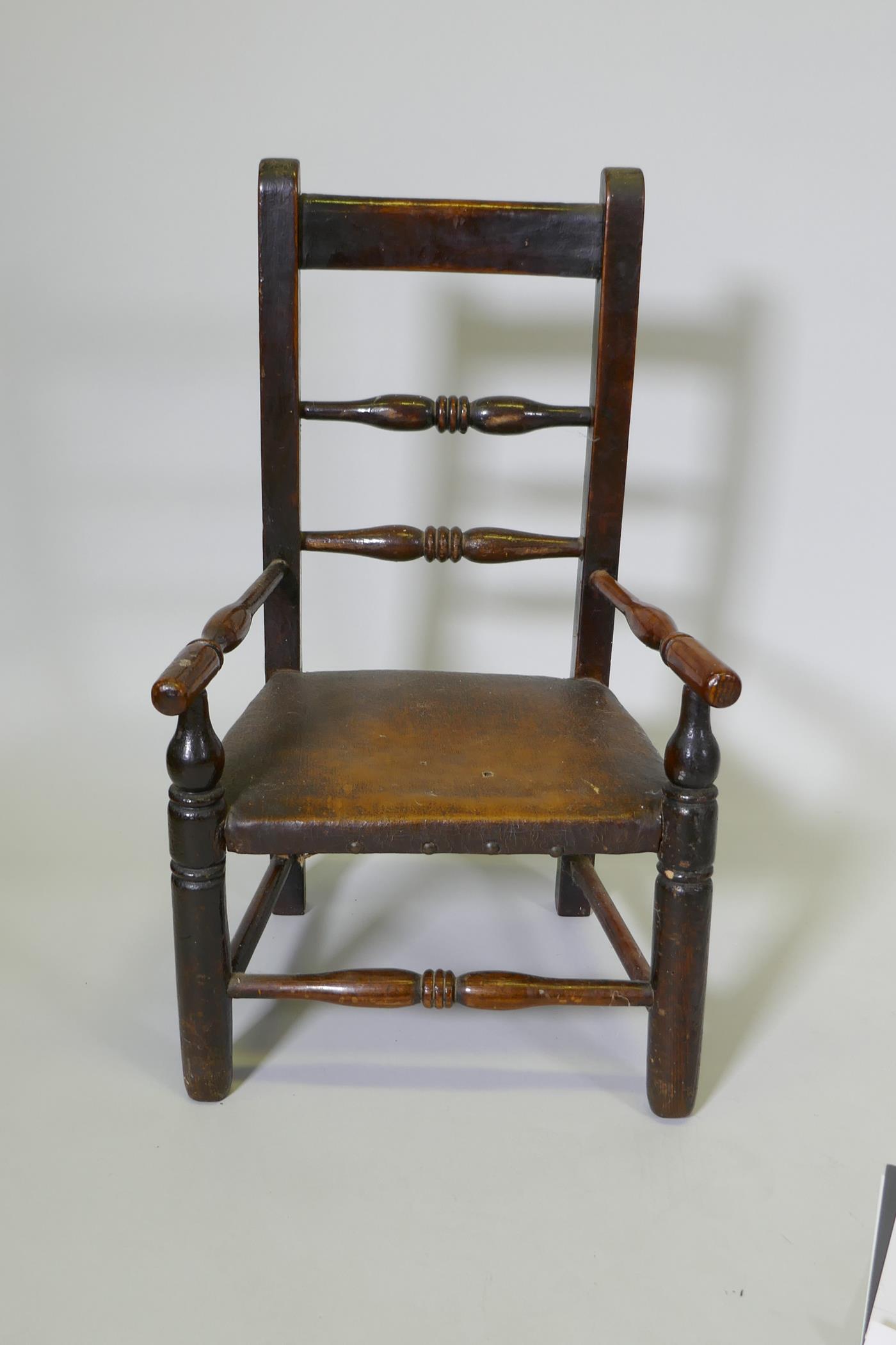 A C19th child's elm spindle back open armchair, 68cm high - Image 2 of 3