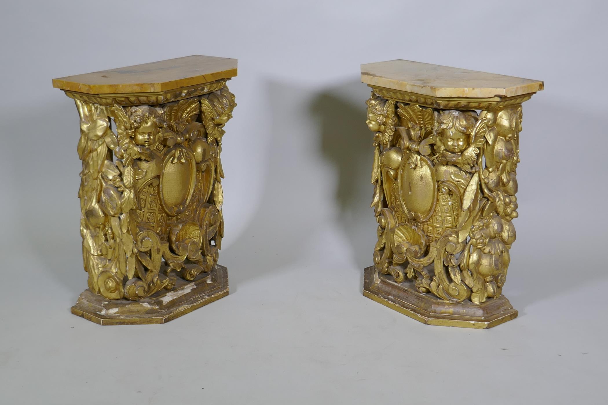 A pair of early C19th carved and giltwood pine pedestals/stands, decorated with winged putti and - Image 4 of 5