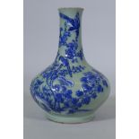 A Chinese celadon glazed vase with raised blue and white decoration of birds and bats, C19th/