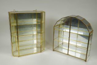 Two mirror back brass display cases, largest 29 x 36cm