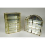 Two mirror back brass display cases, largest 29 x 36cm