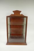 A mahogany desk top display cabinet, and a smaller display case, largest 31 x 29cm, 50cm high