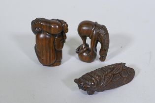 A carved wood netsuke in the form of a cicada, 6.5cm long, a wood okimono of a balancing horse,