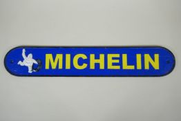 A 'Michelin' painted cast iron wall plaque, 50cm long