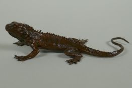 A Japanese style bronze okimono iguana, 5cm long