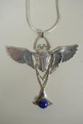 A sterling silver pendant necklace in the form of a winged beetle, set with lapiz, 9cm wide