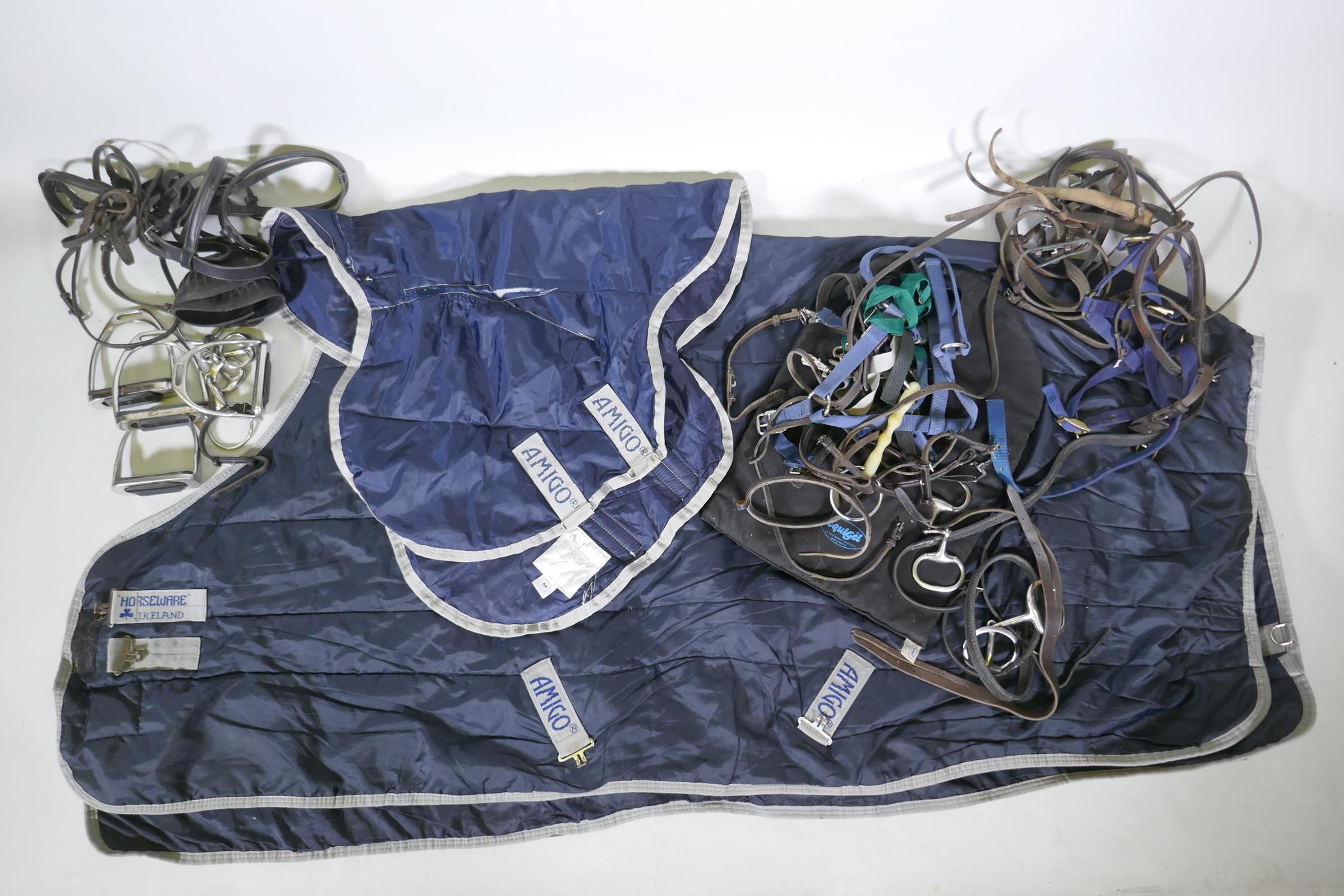 A quantity of equestrian equipment including Amigo Horseware stable/under blanket, Equigel saddle